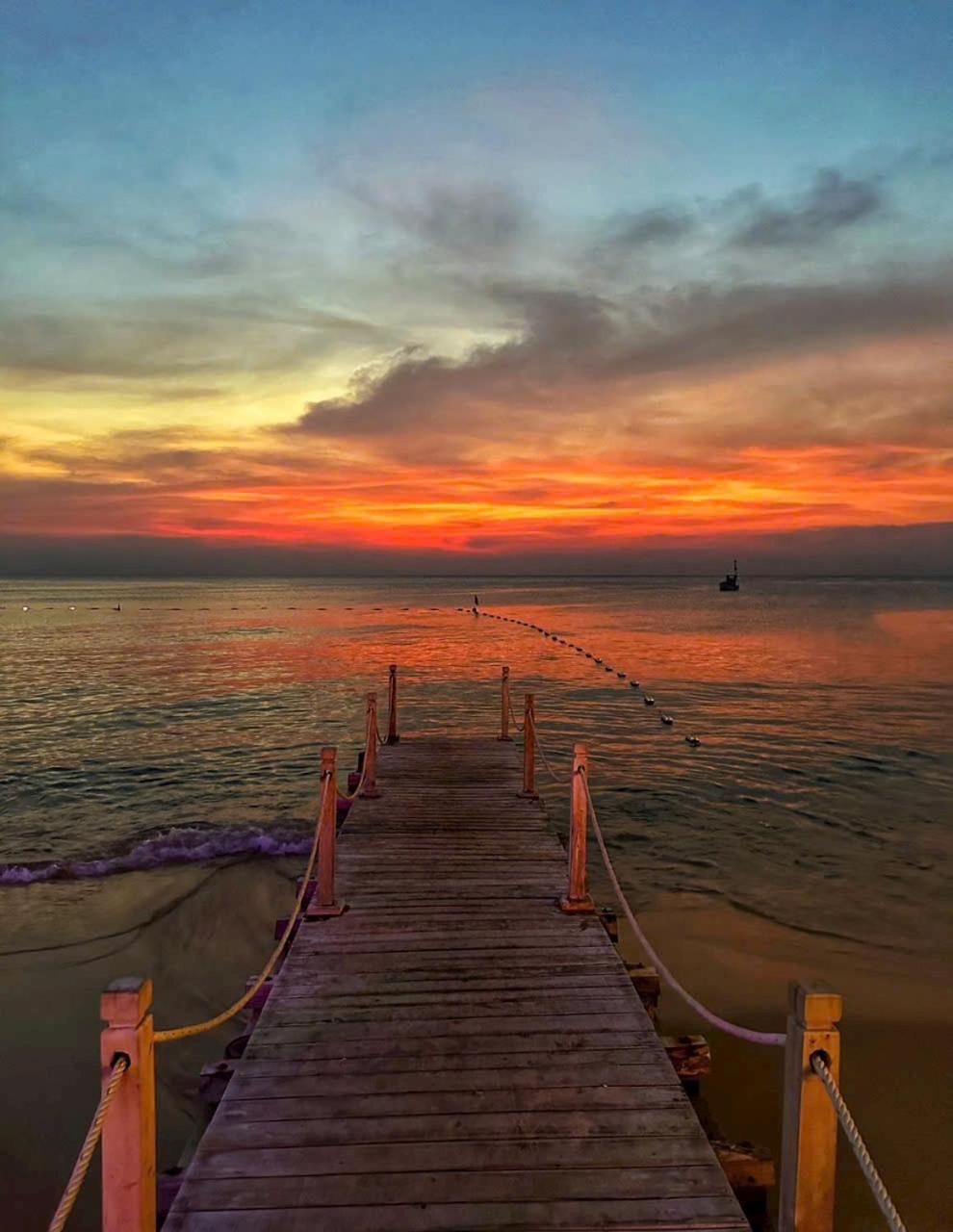 Sunset And Hotel